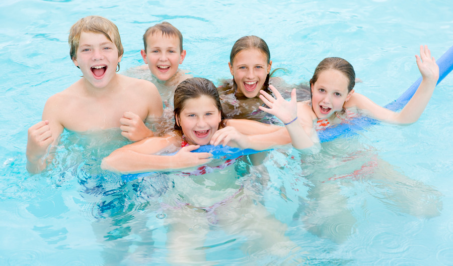 2165825-five-young-friends-in-swimming-pool-playing-and-smiling.jpg