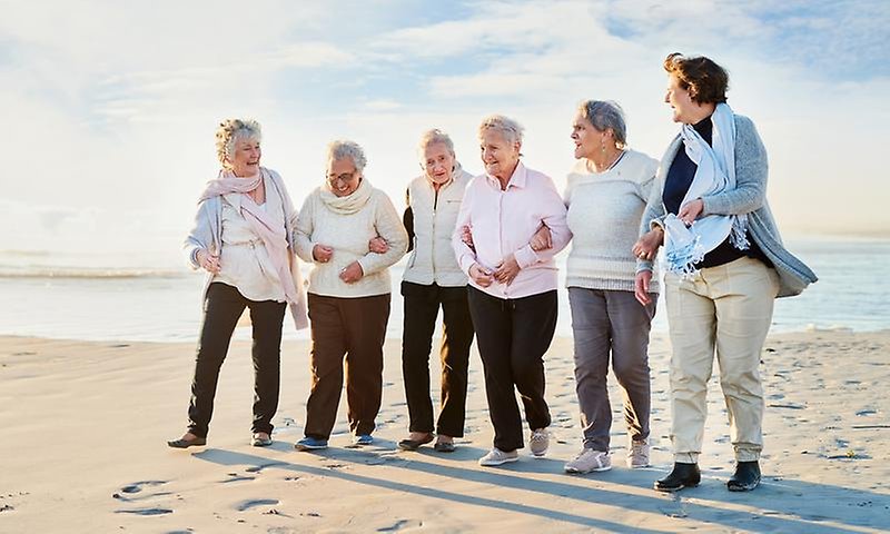 Shot of a group of senior women going for a walk along the beach